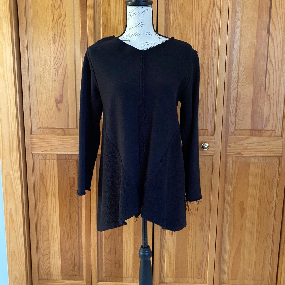 Casual black long top with raw edge detail.